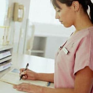 woman writing down information