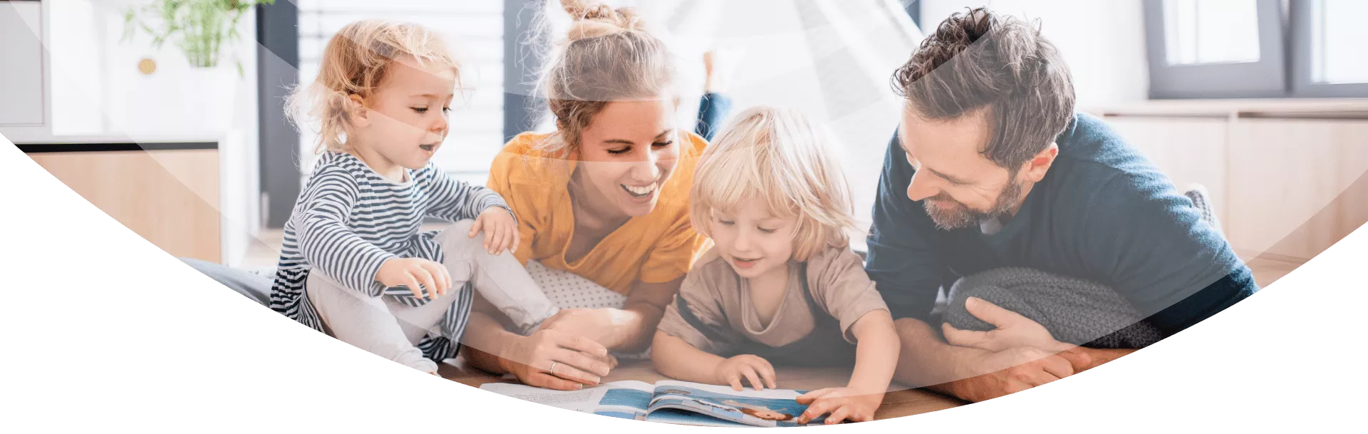 family laying down together and reading