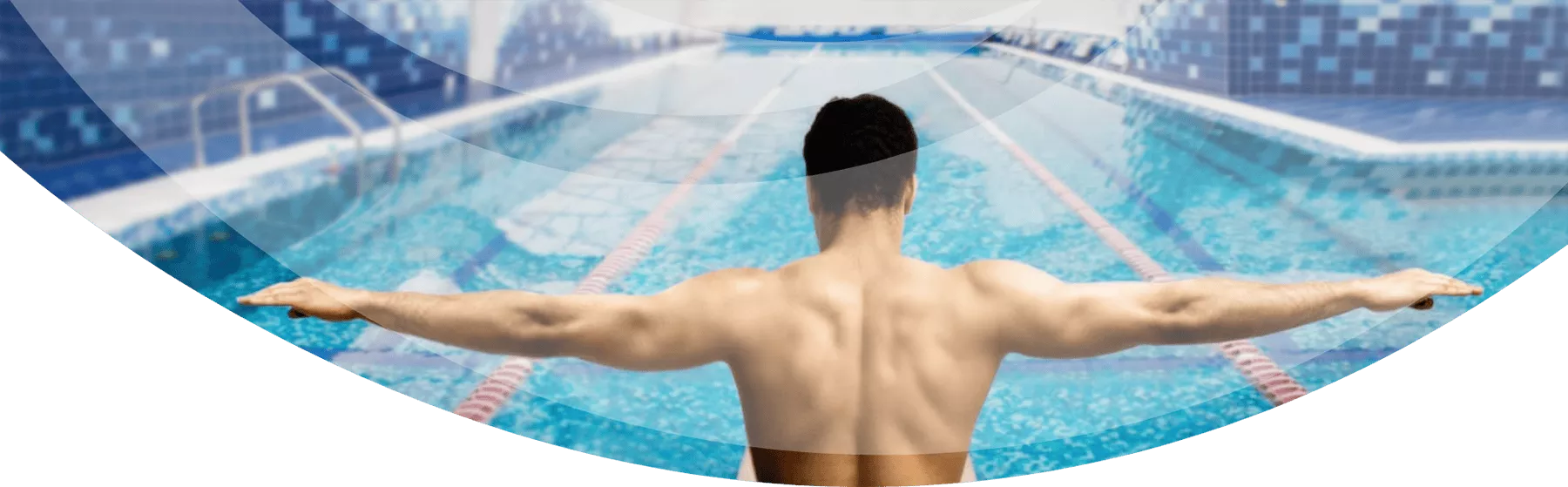 man preparing to swim indoors